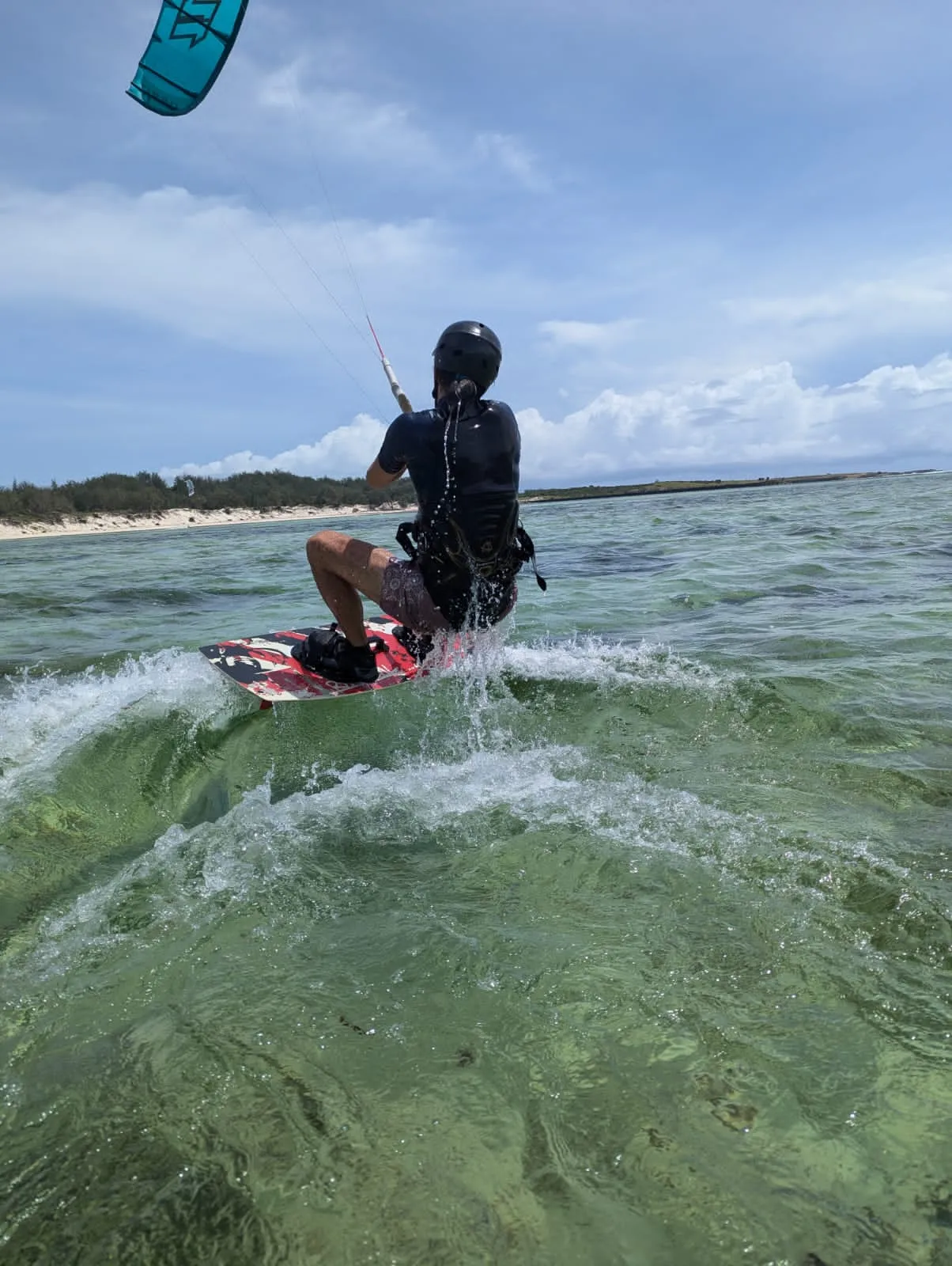 Kitesurfer jumping at golden hour